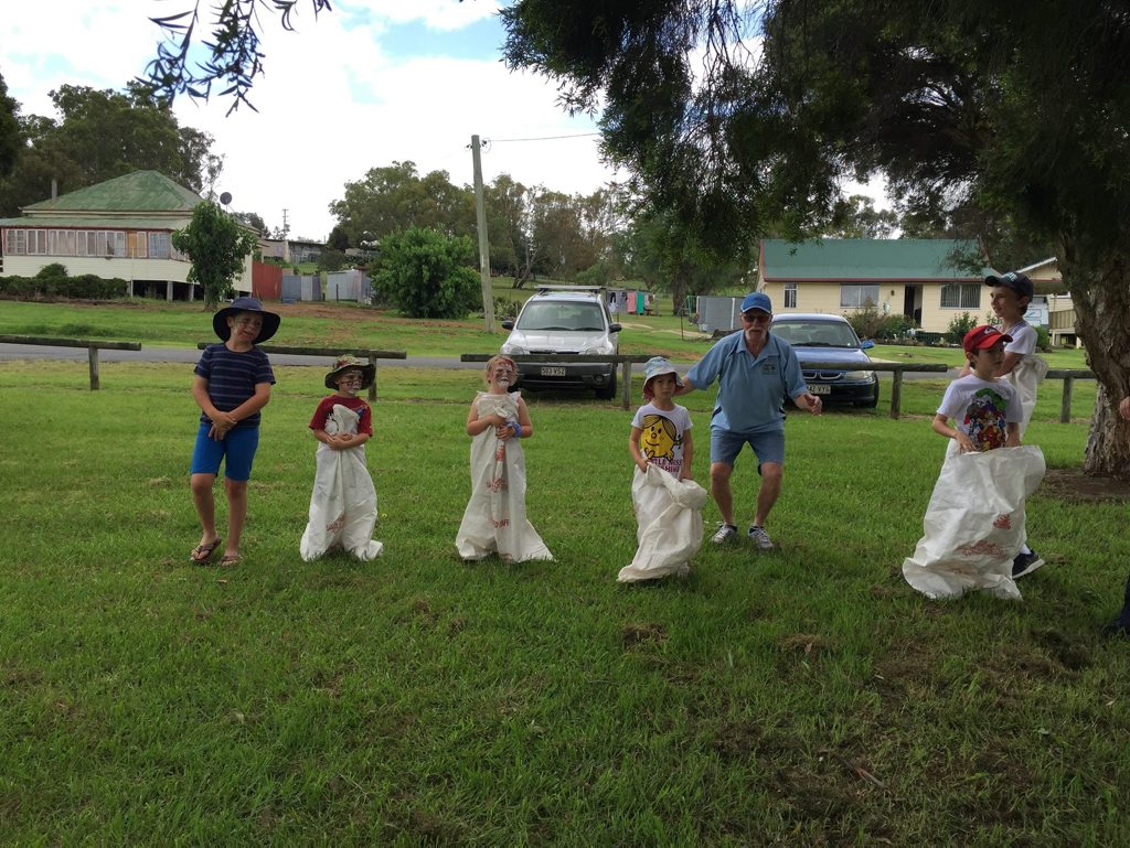 Yangan and District Progress Association's Colin Pope with some of the more than 50 kids who took part in the Christmas event. Photo Contributed
